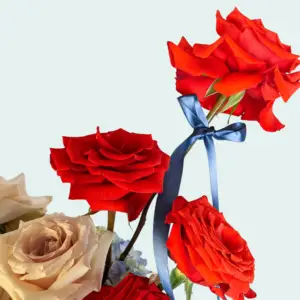 This is a closeup image of the blue ribbon in the flower arrangement called infinite rodeo.